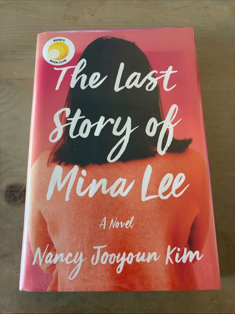The Last Story of Mina Lee by Nancy Jooyoun Kim - Coral/Pink Cover